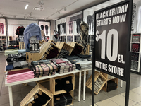 Signs for Black Friday sales are in stores at a shopping mall in Toronto, Ontario, Canada, on November 26, 2024 (