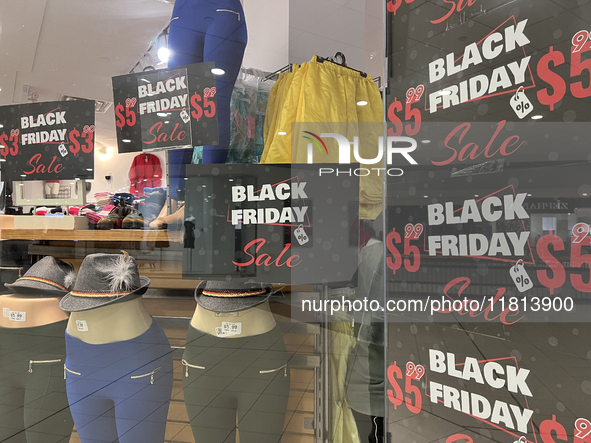 Signs for Black Friday sales are in stores at a shopping mall in Toronto, Ontario, Canada, on November 26, 2024 