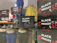 Signs for Black Friday sales are in stores at a shopping mall in Toronto, Ontario, Canada, on November 26, 2024 (