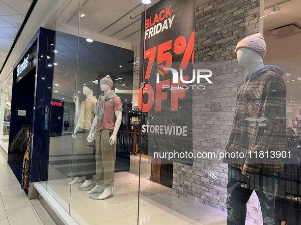 Signs for Black Friday sales are in stores at a shopping mall in Toronto, Ontario, Canada, on November 26, 2024 