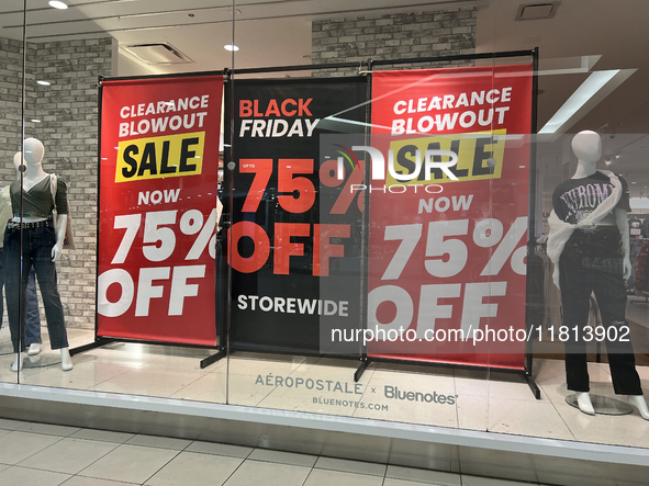 Signs for Black Friday sales are in stores at a shopping mall in Toronto, Ontario, Canada, on November 26, 2024 