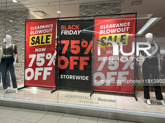 Signs for Black Friday sales are in stores at a shopping mall in Toronto, Ontario, Canada, on November 26, 2024 (