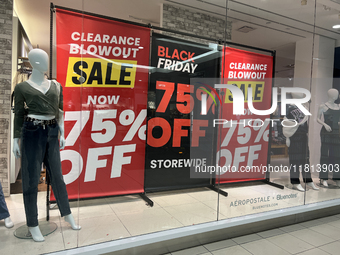 Signs for Black Friday sales are in stores at a shopping mall in Toronto, Ontario, Canada, on November 26, 2024 (