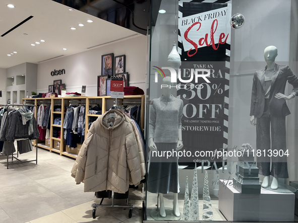 Signs for Black Friday sales are in stores at a shopping mall in Toronto, Ontario, Canada, on November 26, 2024 