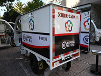 An express delivery vehicle is at the gate of an SF Express station in Nanjing, China, on November 27, 2024. (