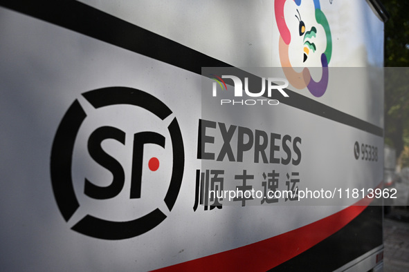 An express delivery vehicle is at the gate of an SF Express station in Nanjing, China, on November 27, 2024. 