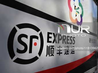 An express delivery vehicle is at the gate of an SF Express station in Nanjing, China, on November 27, 2024. (