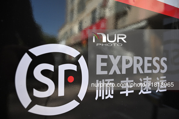 An express delivery vehicle is at the gate of an SF Express station in Nanjing, China, on November 27, 2024. 