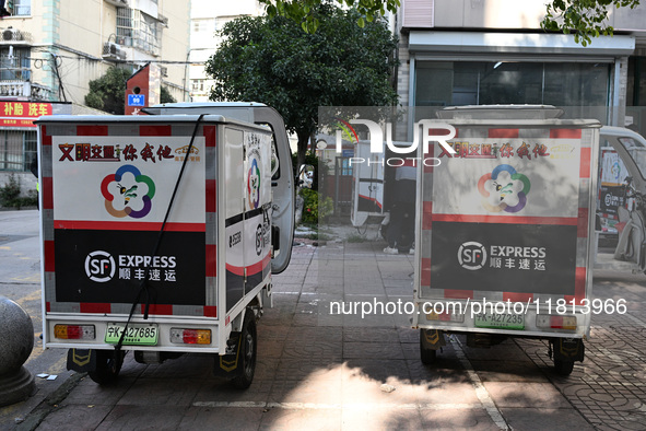 An express delivery vehicle is at the gate of an SF Express station in Nanjing, China, on November 27, 2024. 