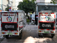 An express delivery vehicle is at the gate of an SF Express station in Nanjing, China, on November 27, 2024. (