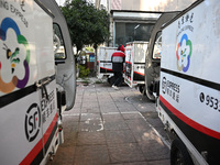 An express delivery vehicle is at the gate of an SF Express station in Nanjing, China, on November 27, 2024. (