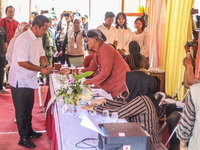 People participate in the simultaneous regional election at a polling station in Semarang, Central Java Province, on November 27, 2024. Indo...