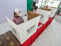 Inmates participate in the simultaneous regional election at a polling station in a prison in Semarang, Central Java Province, on November 2...