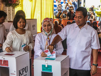 People participate in the simultaneous regional election at a polling station in Semarang, Central Java Province, on November 27, 2024. Indo...