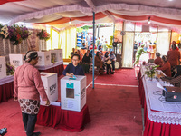 People participate in the simultaneous regional election at a polling station in Semarang, Central Java Province, on November 27, 2024. Indo...