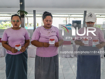 Inmates participate in the simultaneous regional election at a polling station in a prison in Semarang, Central Java Province, on November 2...