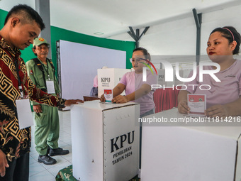 Inmates participate in the simultaneous regional election at a polling station in a prison in Semarang, Central Java Province, on November 2...