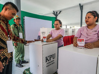 Inmates participate in the simultaneous regional election at a polling station in a prison in Semarang, Central Java Province, on November 2...