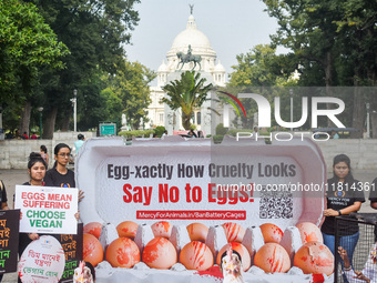 Activists of Mercy for Animals India wear chicken costumes during a protest demonstration against the use and consumption of eggs and to spr...