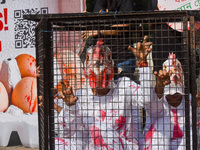 Activists of Mercy for Animals India wear chicken costumes during a protest demonstration against the use and consumption of eggs and to spr...