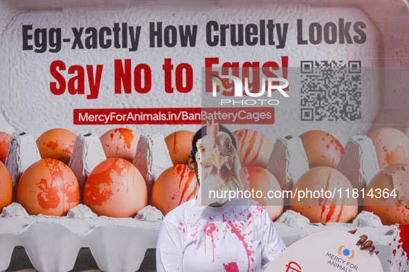 Activists of Mercy for Animals India wear chicken costumes during a protest demonstration against the use and consumption of eggs and to spr...