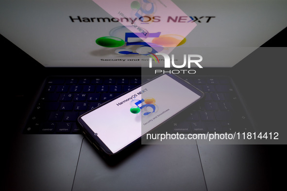 The logo of the Huawei HarmonyOS NEXT operating system appears on a smartphone screen and on a computer screen as a background in this photo...