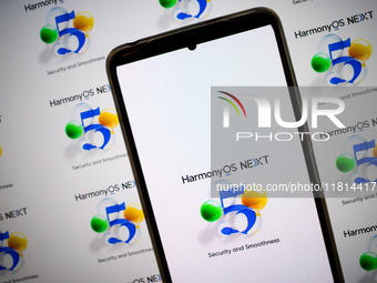 The logo of the Huawei HarmonyOS NEXT operating system appears on a smartphone screen and on a computer screen as a background in this photo...