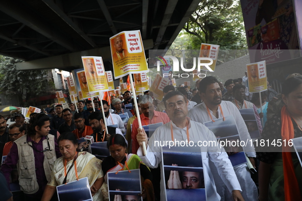 Bharatiya Janata Party (BJP) activists shout slogans and carry placards during a protest rally towards the Bangladesh High Commission in Kol...