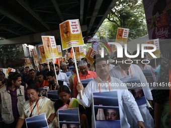 Bharatiya Janata Party (BJP) activists shout slogans and carry placards during a protest rally towards the Bangladesh High Commission in Kol...