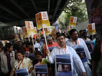 Bharatiya Janata Party (BJP) activists shout slogans and carry placards during a protest rally towards the Bangladesh High Commission in Kol...