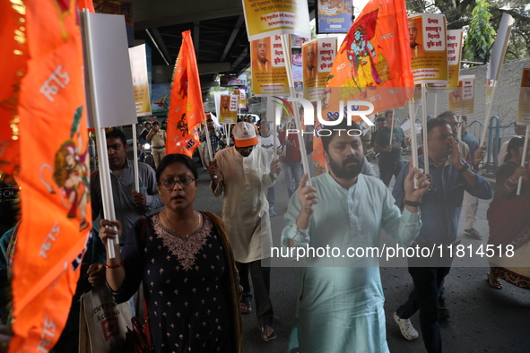 Bharatiya Janata Party (BJP) activists shout slogans and carry placards during a protest rally towards the Bangladesh High Commission in Kol...