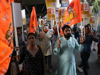 Bharatiya Janata Party (BJP) activists shout slogans and carry placards during a protest rally towards the Bangladesh High Commission in Kol...