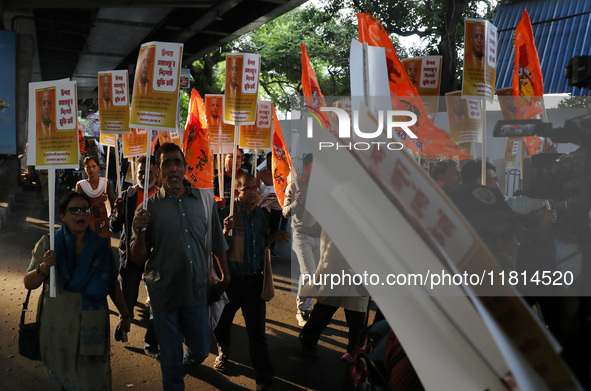 Bharatiya Janata Party (BJP) activists shout slogans and carry placards during a protest rally towards the Bangladesh High Commission in Kol...