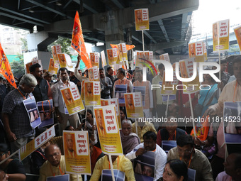 Bharatiya Janata Party (BJP) activists shout slogans and carry placards during a protest rally towards the Bangladesh High Commission after...