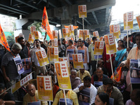 Bharatiya Janata Party (BJP) activists shout slogans and carry placards during a protest rally towards the Bangladesh High Commission after...