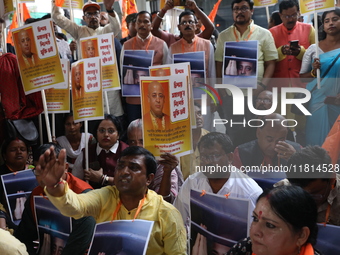 Bharatiya Janata Party (BJP) activists shout slogans and carry placards during a protest rally towards the Bangladesh High Commission after...