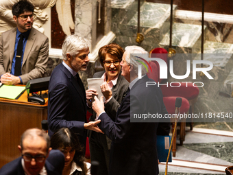 In Paris, France, on November 26, 2024, French Prime Minister Michel Barnier (right) discusses with Laurent Wauquiez (left), President of th...