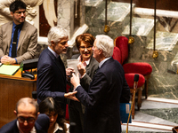 In Paris, France, on November 26, 2024, French Prime Minister Michel Barnier (right) discusses with Laurent Wauquiez (left), President of th...