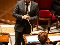 Antoine Armand, the French Minister of Economy, Finance, and Industry, speaks at the public session of questions to the French government at...