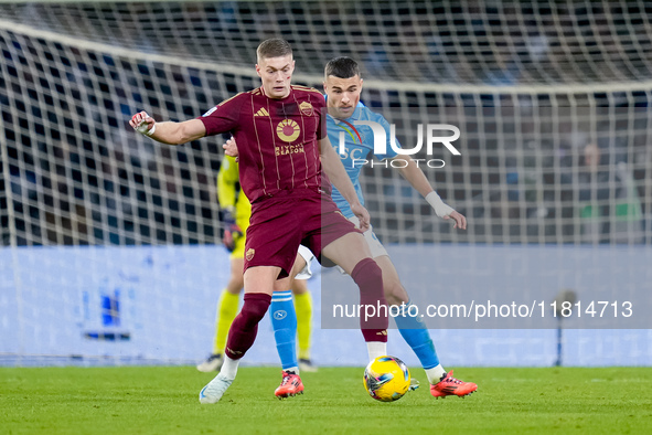 Alessandro Buongiorno of SSC Napoli and Artem Dovbyk of AS Roma compete for the ball during the serie Serie A Enilive match between SSC Napo...