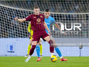 Alessandro Buongiorno of SSC Napoli and Artem Dovbyk of AS Roma compete for the ball during the serie Serie A Enilive match between SSC Napo...