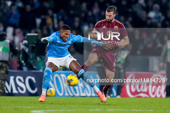 Michael Folorunsho of SSC Napoli and Bryan Cristante of AS Roma compete for the ball during the serie Serie A Enilive match between SSC Napo...