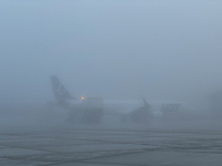 LOT Polish Airlines plane is seen on the foggy morning at the airport in Balice near Krakow, Poland on November 27, 2024. (