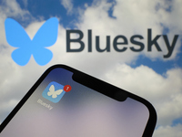 A close-up of the Bluesky social media app icon (