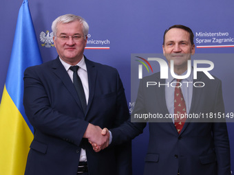 Radoslaw Sikorski, Minister of Foreign Affairs of Poland and  Andriy Sybiha, Minister of Foreign Affairs of Ukraine, shake hands during the...