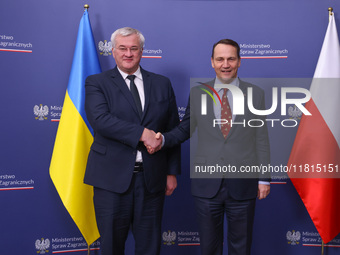 Radoslaw Sikorski, Minister of Foreign Affairs of Poland and  Andriy Sybiha, Minister of Foreign Affairs of Ukraine, shake hands during the...