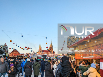 A snow-covered scene at the Winter Tollwood Festival on December 3, 2023, in Munich, Germany, shows the event's focus on art, culture, and s...