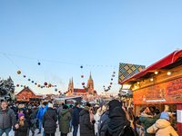 A snow-covered scene at the Winter Tollwood Festival on December 3, 2023, in Munich, Germany, shows the event's focus on art, culture, and s...