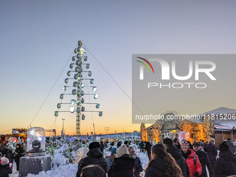 A snow-covered scene at the Winter Tollwood Festival on December 3, 2023, in Munich, Germany, shows the event's focus on art, culture, and s...