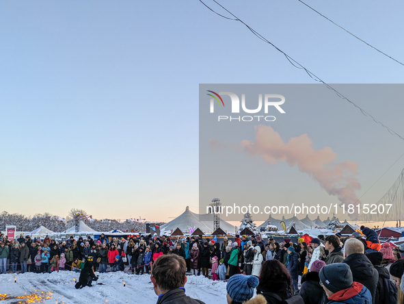 A snow-covered scene at the Winter Tollwood Festival on December 3, 2023, in Munich, Germany, shows the event's focus on art, culture, and s...